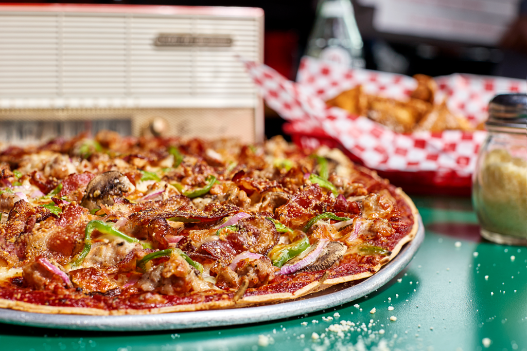 A deluxe large specialty pizza from Imo’s Pizza.